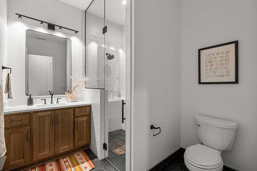 Bathroom and shower of modern custom home by Kingston Homes