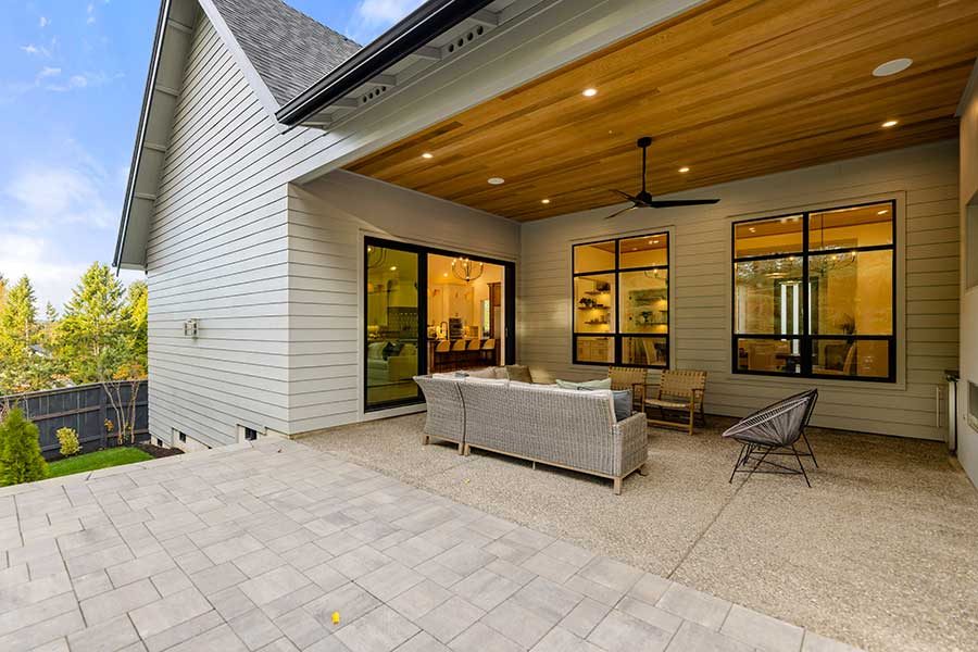 Backporch and outdoor living area of modern custom home by Kingston Homes